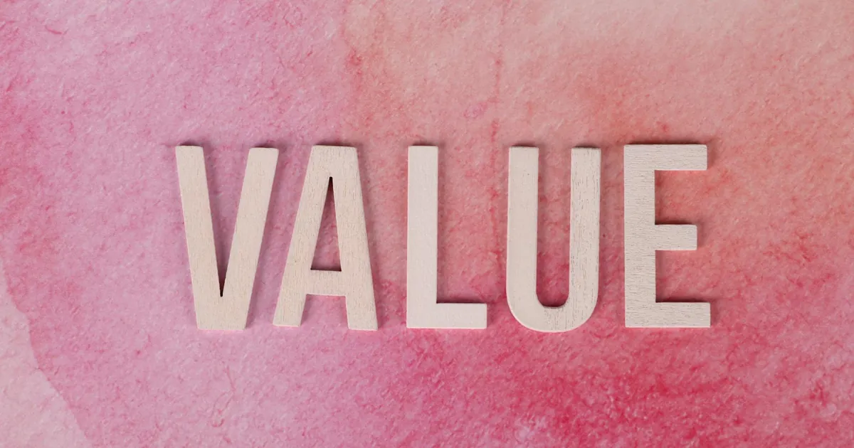 The word 'VALUE' in bold letters on a textured pink background.