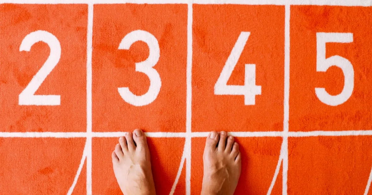 person standing on orange floor