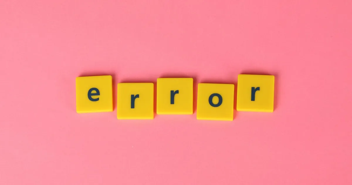 Yellow block letters spelling 'error' on a vibrant pink background, capturing a playful message.
