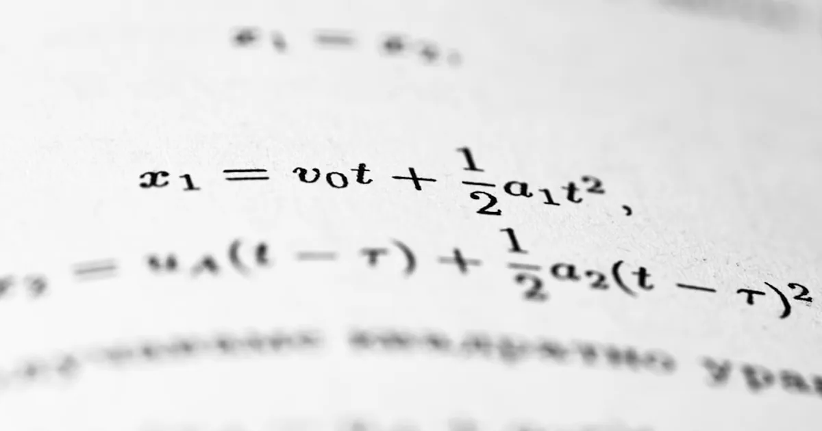 Mathematical formulas are written on the paper.
