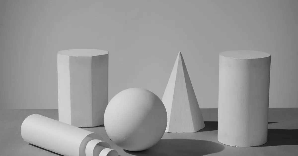 Black and white photo featuring 3D geometric shapes in a minimalist composition. Black and white photo featuring 3D geometric shapes in a minimalist composition.