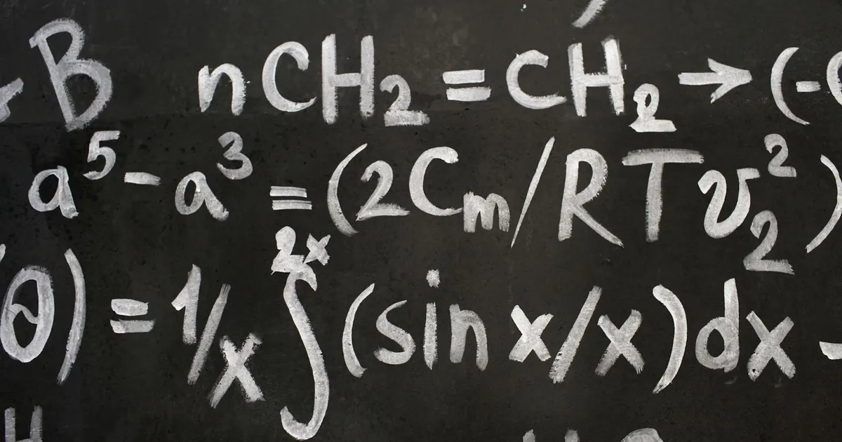 Close-up of complex equations on a chalkboard, showcasing chemistry and math symbols. Close-up of complex equations on a chalkboard, showcasing chemistry and math symbols.