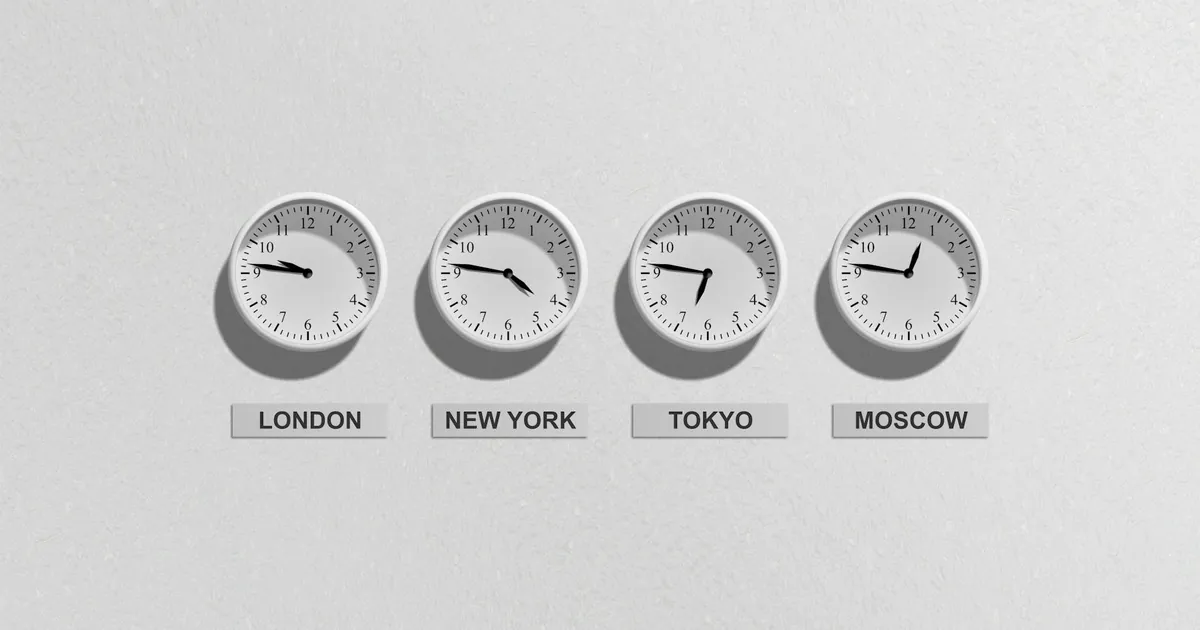Four wall clocks showing different time zones for London, New York, Tokyo, and Moscow. Four wall clocks showing different time zones for London, New York, Tokyo, and Moscow.